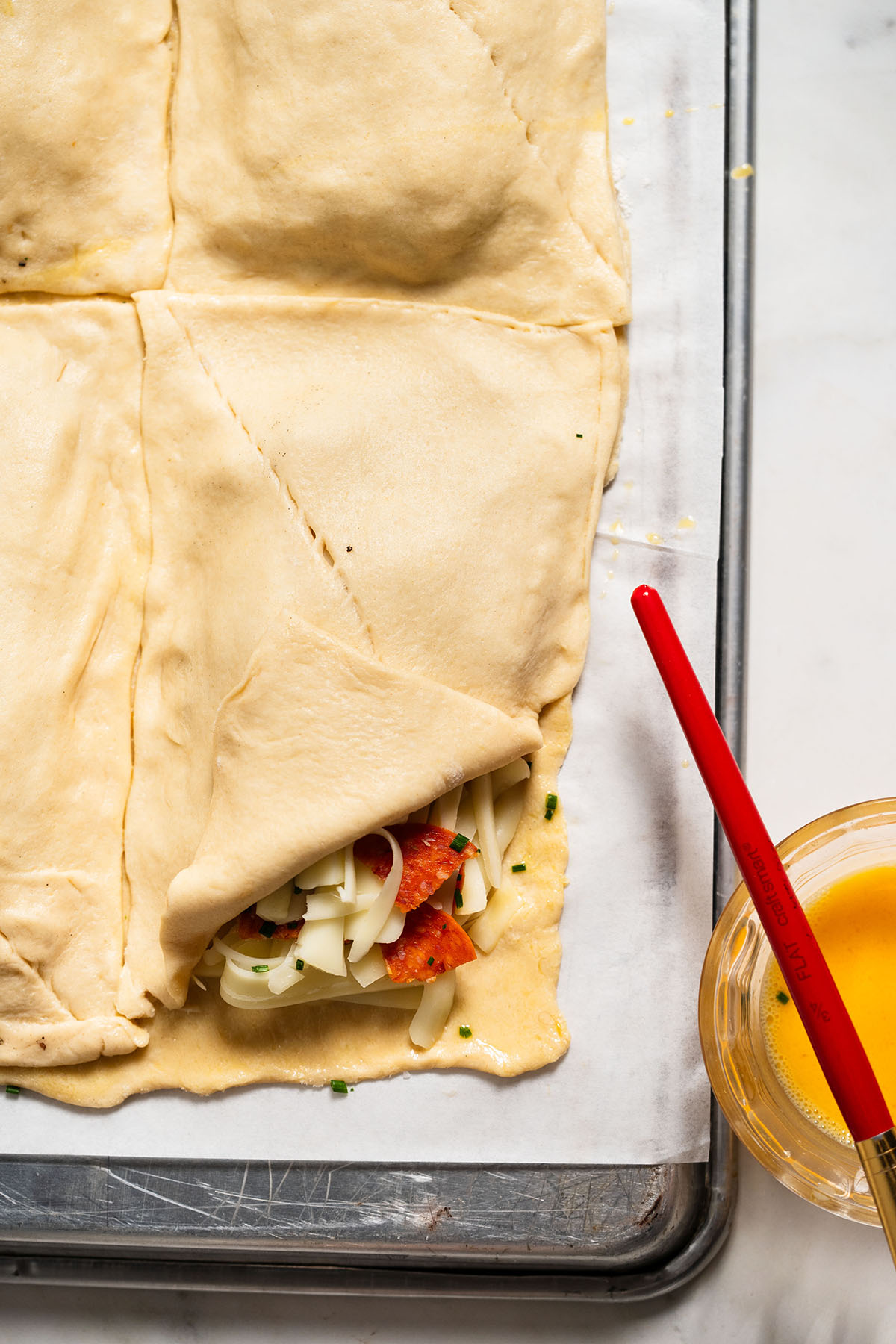 Air Fryer Pizza Pocket step by step instructions of dough being sealed.