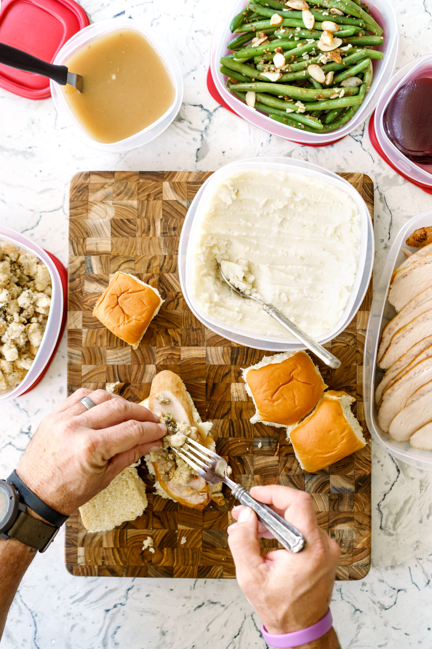 Rubbermaid EasyFindLids filled with organized Thanksgiving leftovers in the fridge.