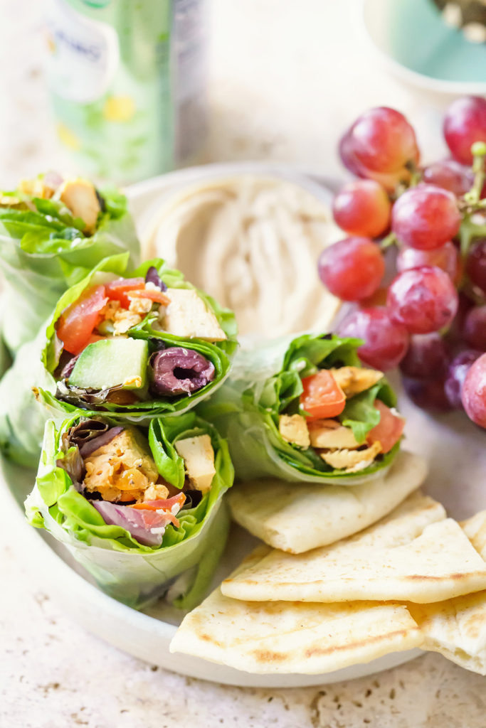 Handheld salad wraps filled with crisp lettuce, veggies, and grilled chicken wrapped in soft tortillas